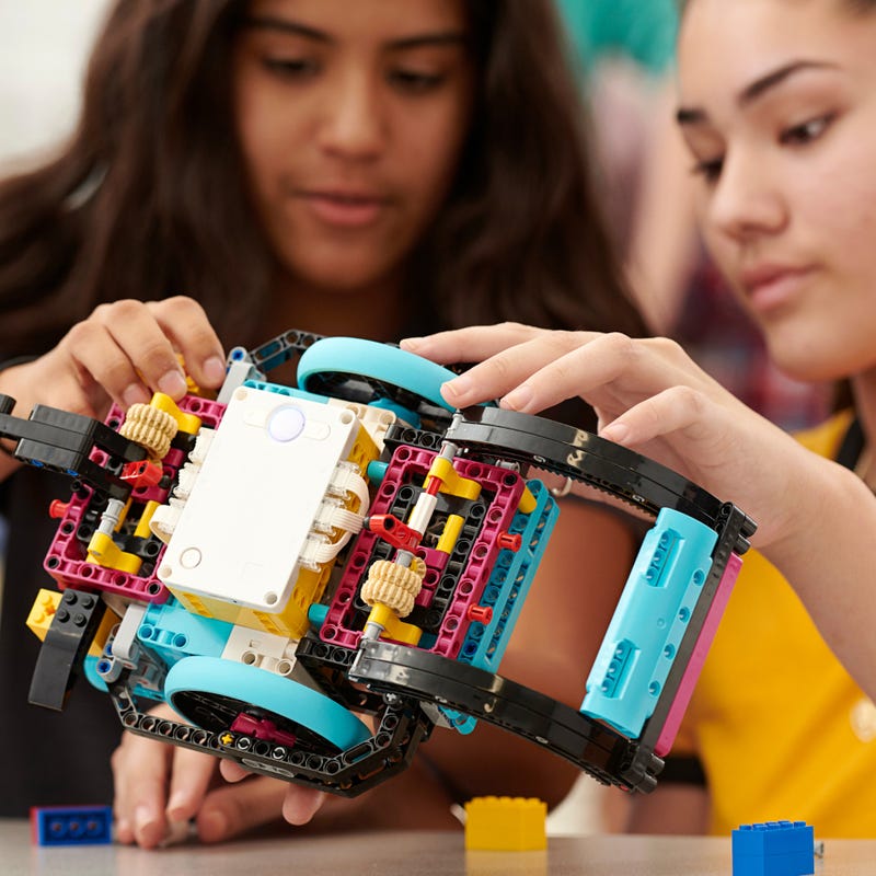 two girls building robot
